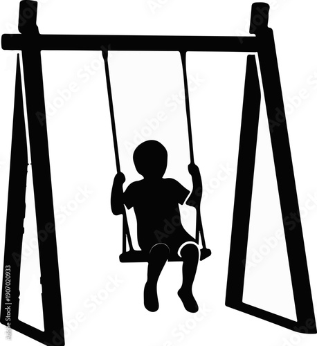 Silhouette of a child on a swing set