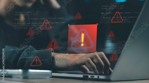 Cybersecurity warning concept showing alert icons on laptop screen, indicating system error, virus, hacker threat, bug in code, or online danger with red exclamation symbols during coding activity.