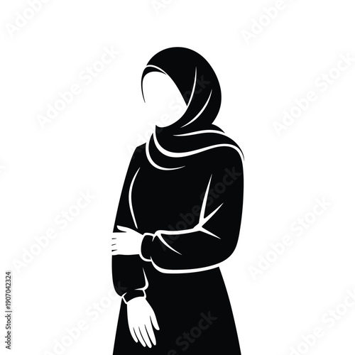Silhouette of a woman wearing a hijab arms crossed in profile