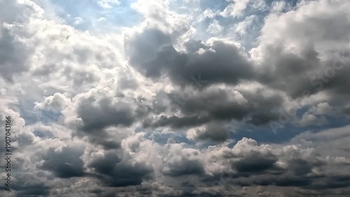 Flowing rainy clouds in the blue skies. 4K video (Ultra High Definition) of dramatic cloudscape. Sky and clouds Timelapse.