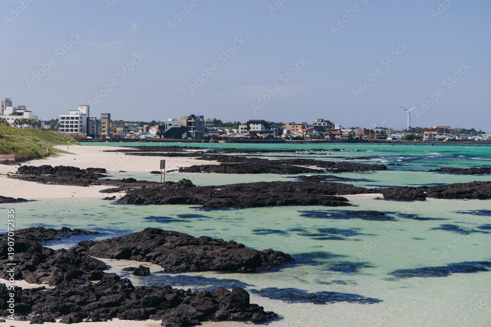 Fototapeta premium Jeju Island, Hyeopjae Beach, Hallim, white sand beach and sea, Hallim-ro, Hallim-eup, Geumneung Beach, Jeju-do, South Korea, Jeju Province, landscape view in a sunny day, and Biyangdo island
