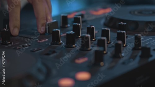 A detailed close-up shot of a female DJ's hand operating a turntable, capturing the essence of a live DJ performance. The image highlights the turntable's jog wheel, knobs, and faders,	