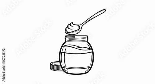 Spoon scoops creamy contents from open jar with lid beside it