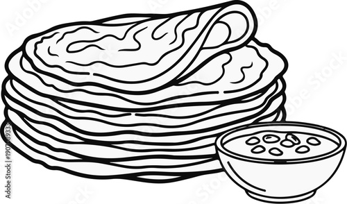 Stack of flatbreads next to a bowl of dipping sauce