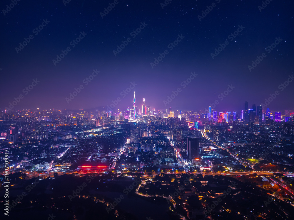 Fototapeta premium Aerial night view of Guangzhou China skyline illuminated with city lights