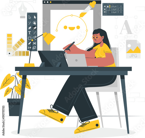 Woman designing on laptop with creative elements around her workspace in a modern office setting from a slightly elevated viewpoint