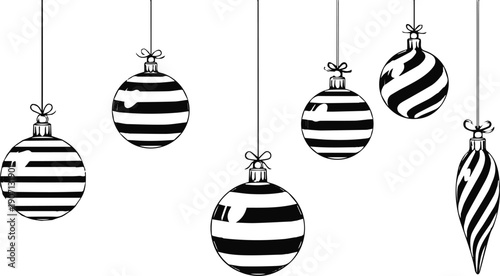 A collection of striped christmas ornaments hanging from strings on a white background.