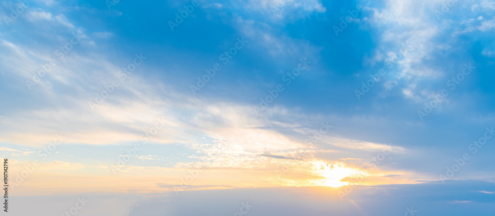Fototapeta premium Sunset Sky with Sun in the Lower Third and Open Cloud Space