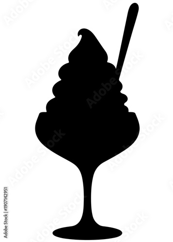 A classic ice cream sundae topped with whipped cream and a cherry on a long stemmed spoon