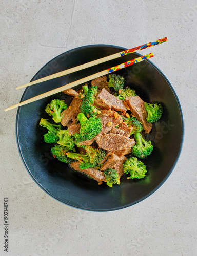 Asian style beef and broccoli served with a side of white rice