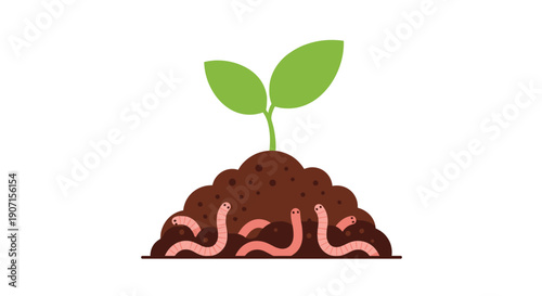 A healthy green seedling with prominent leaves is growing in a dark soil mound surrounded by many pink earthworms.
