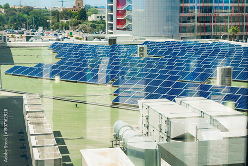 Wallpaper Mural Rooftop solar farm above modern offices, solar output cuts emissions, solar investment fits ESG strategy, sustainable city energy concept for green business, climate content Torontodigital.ca