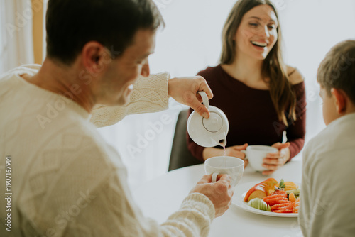 Family enjoys breakfast tog...