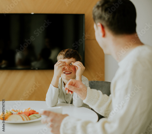 Father and son share a fun ...