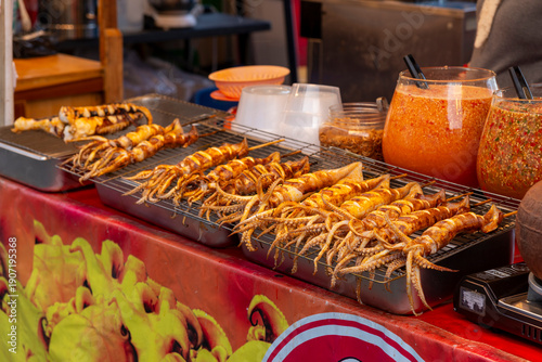 Fotografie Phnom Penh, Cambodia, 4th January 2026 - Cooked seafood for sale at a food stall