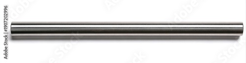 A long, cylindrical, shiny, metallic rod lies horizontally on a white background