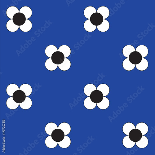 White flowers with black centres on a bright luminous blue background