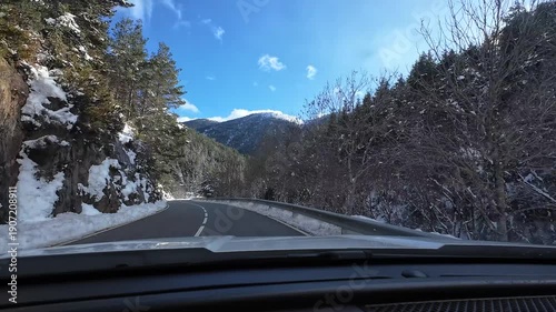 Driving a car on a winding mountain road in La Molina, Pyrenees