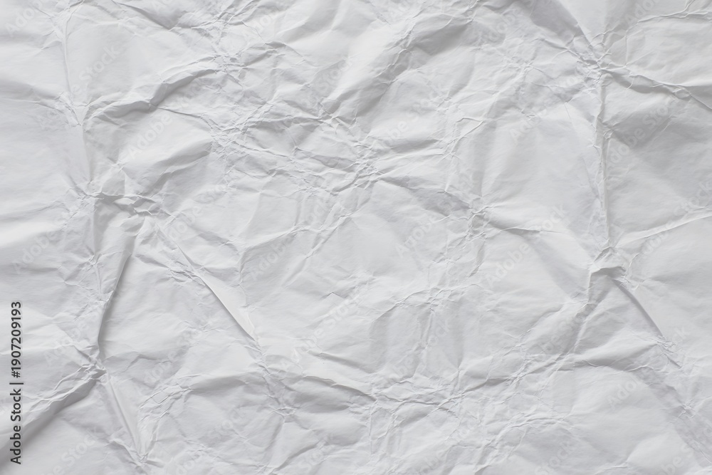 Fototapeta premium White Crumpled Paper Texture Close-up with Soft Shadows - Stock Media