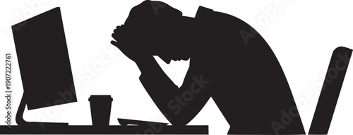 Stressed businessman with head in hands at desk with computer, depicting burnout