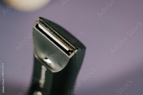 Electric razor on a table for grooming at home