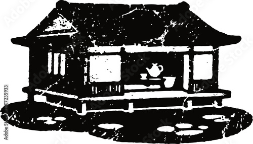 Traditional japanese house with veranda and tea set overlooking garden pond and stepping stones