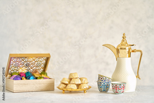 Semolina maamoul cookies with chocolate candy and coffee dallah . Traditional arabic Eid al Adha, Eid al Fitr , Ramadan sweets