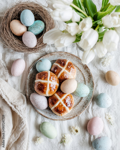 Elegant Easter brunch table setting flat lay with Hot Cross Buns