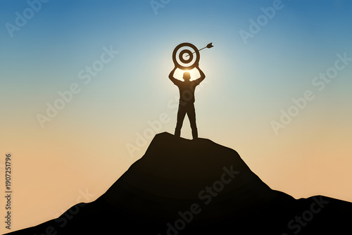 Silhouette of a person standing on a mountain peak holding a target with an arrow  sunny background