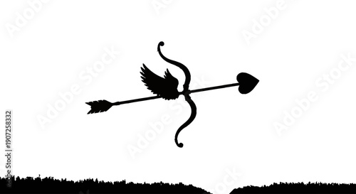 Silhouette of cupid s bow and arrow against a vibrant sunset sky