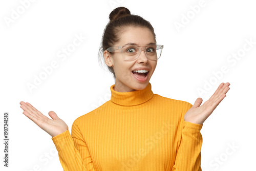 Fotografie Excited woman raising arms wide in celebration wearing yellow turtleneck