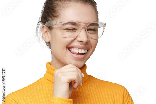 Woman with big smile and winking in yellow turtleneck with clear glasses