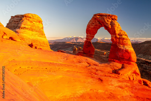 Delicate Arch Glowing at Sunset in Arches National Park, Utah with La Sal Mountains