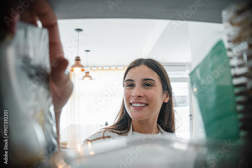 Fotografija Young woman in first person taking merchandise out of a drawer