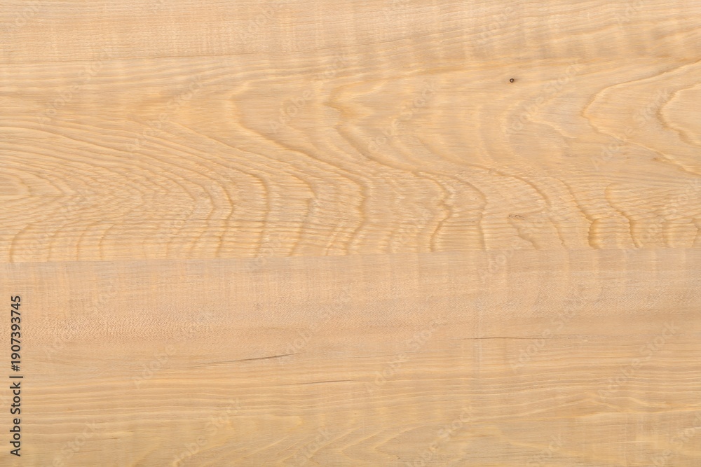 Fototapeta premium Natural light ash wood grain texture seamless background with subtle flowing waves and warm creamy beige natural figure patterns