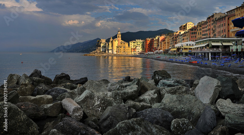 reflection in the water Colorful town of Camogli, brightly in the light of th...
