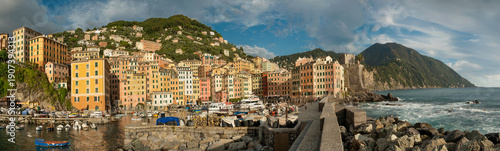 the embankment and port of the town of Camogli, colorful houses and fortress