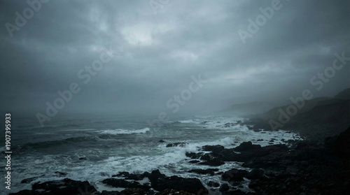 Coastal Drama: The turbulent ocean, under a dramatic, overcast sky, crashes against a rocky shore, evoking a sense of raw power and the relentless beauty of nature. 
