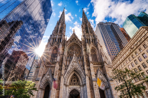 Photography Saint Patrick Cathedral in New York City with Skyscrapers Reflection during a Su
