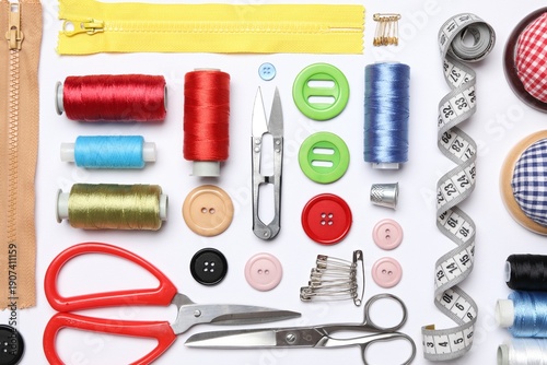 Fotografie Flat lay composition with sewing supplies on white background