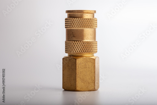 Billede på lærred Professional brass quick release pneumatic coupler with male threaded hex base, durable industrial socket connector for air compressor lines isolated on white background