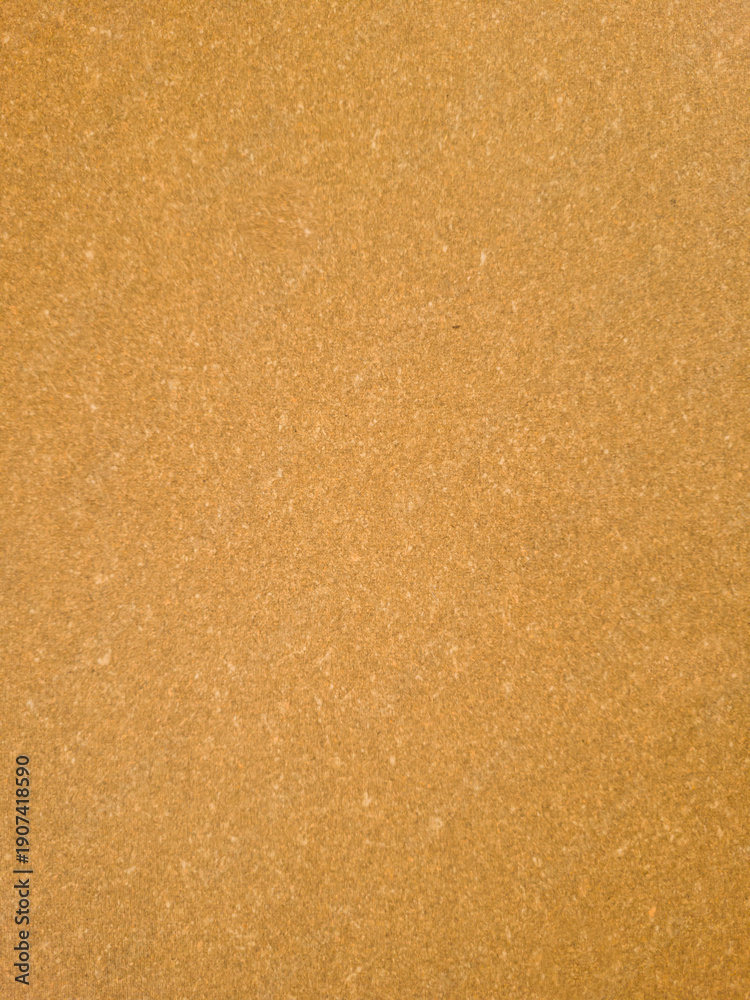 Fototapeta premium Brown leatherboard sheet texture, even surface used as backing material for leather goods, top view.