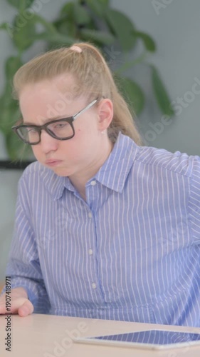 Young Woman with Back Pain Sitting in Office, vertical video
