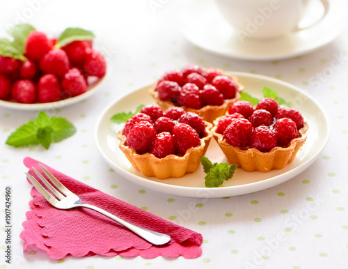 Mini tart with raspberries fruits on the table