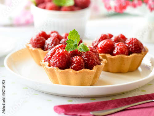 Mini tart with raspberries fruits on the table