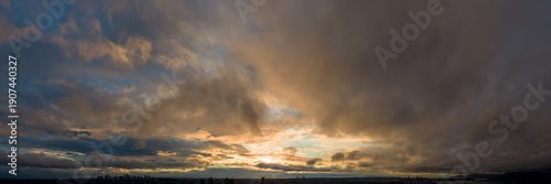 Wallpaper Mural Dramatic Sunset Over Cloudy Sky With City Silhouette at Dusk in BC Canada Torontodigital.ca