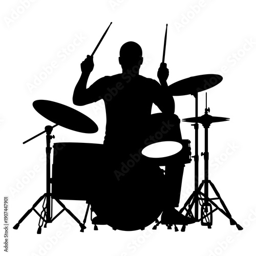 Silhouette of musician energetically playing a complete drum set with sticks