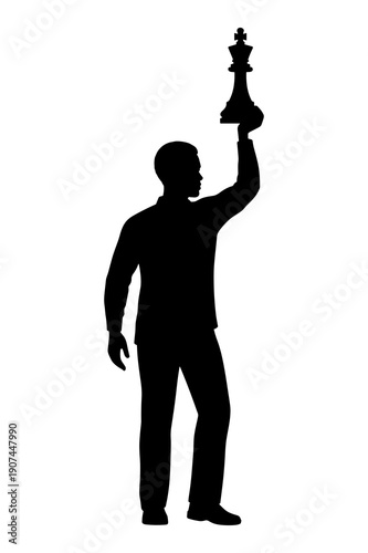 Silhouette of person holding up chess king piece symbolizing victory