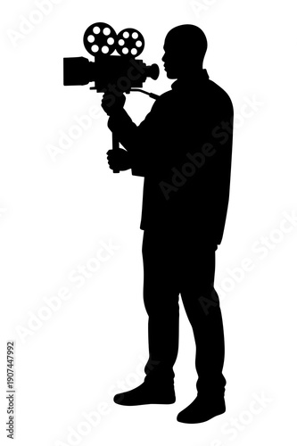 Silhouette of filmmaker operating vintage movie camera for professional video production