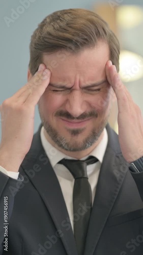 Wallpaper Mural Portrait of Tired Businessman with Headache, vertical video Torontodigital.ca